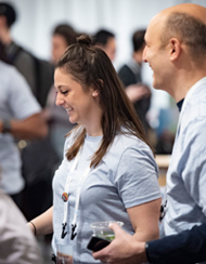 Posit employees working the registration booth at the annual company conference