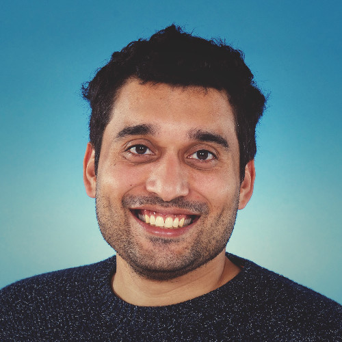 portrait of James Black in front of blue background